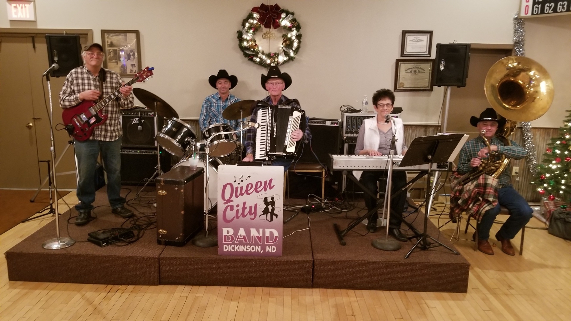 photo of the Queen City Band members on stage