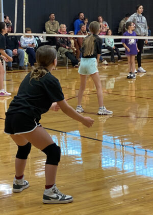 photo of a girl waiting to pass a volleyball
