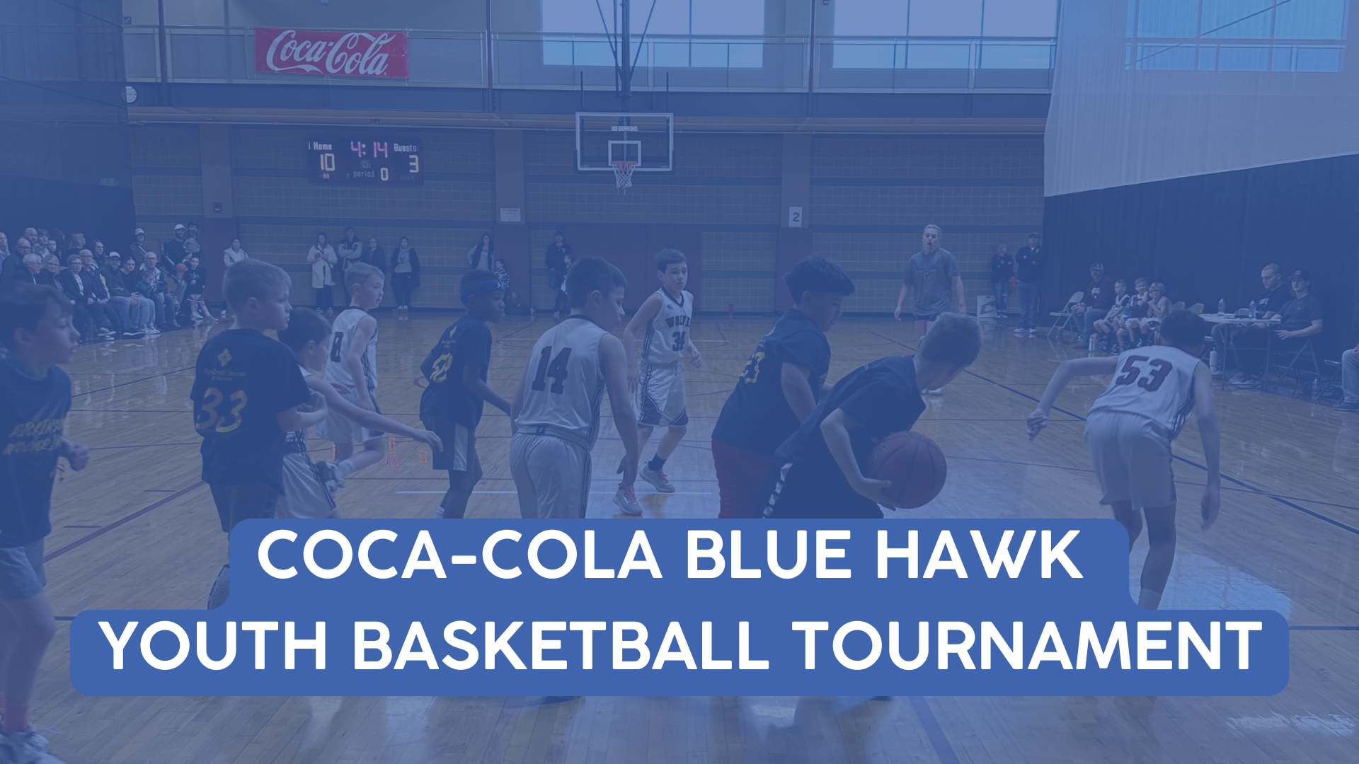 Event cover photo for the Coca-Cola Blue Hawk Basketball Tournament showing youth basketball players playing a game.