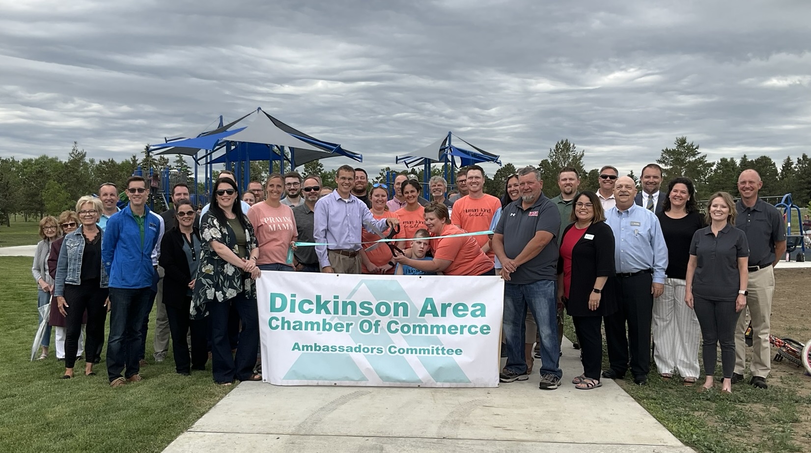 Group photo of Friendship Park ribbon cutting