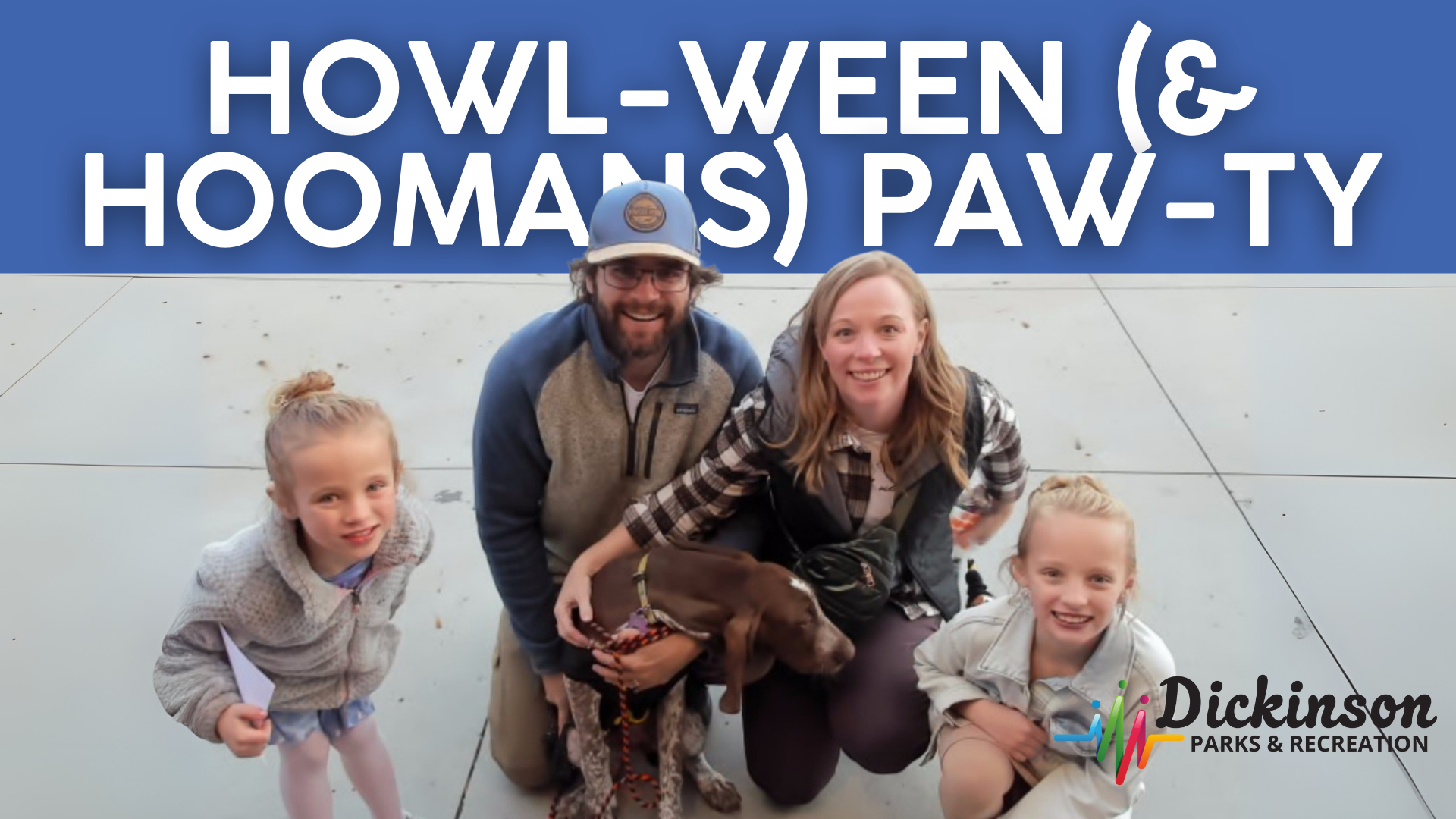 photo of two parents and two children posing with their dog